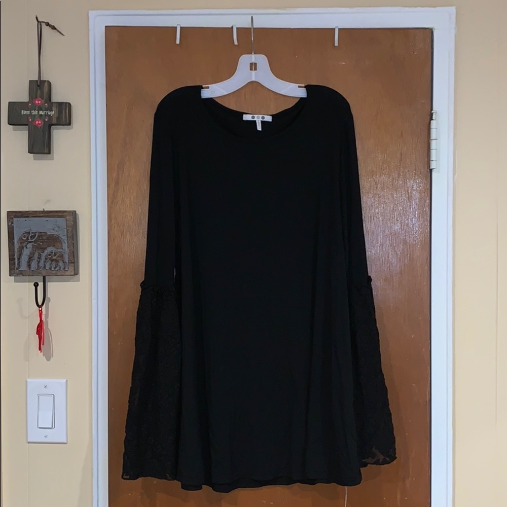 Black long sleeve shirt with lace bell sleeves